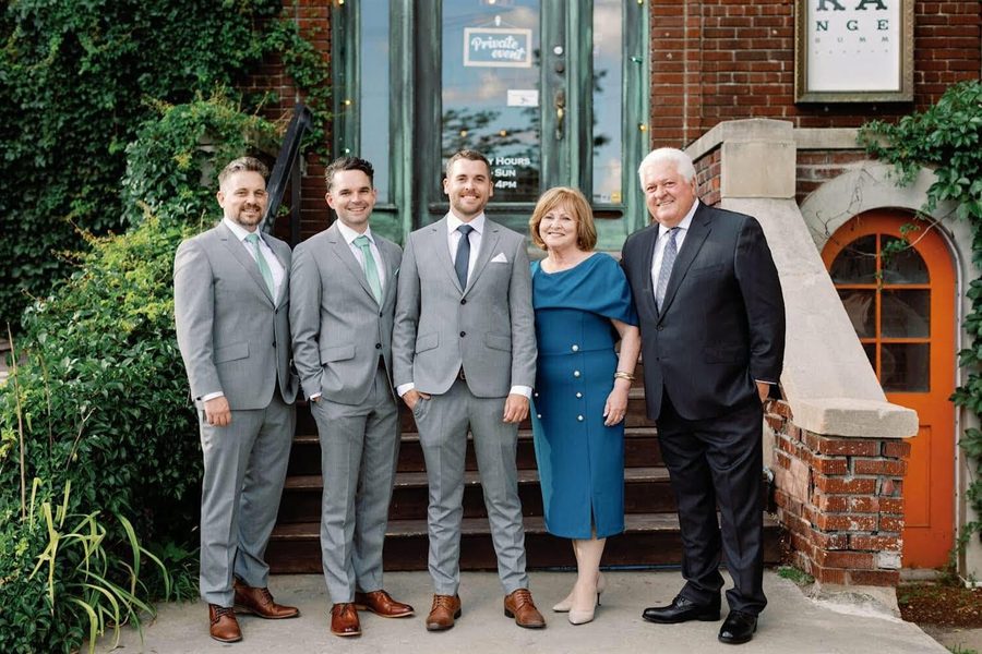 Ron and Annadeane with their three sons at a wedding