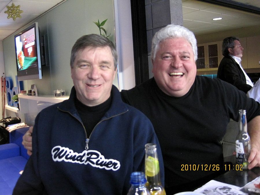 Ron laughing with a friend at a Bell suite, Boxing Day 2010